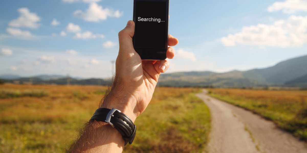 holding a cellphone in the nature, cathing signal