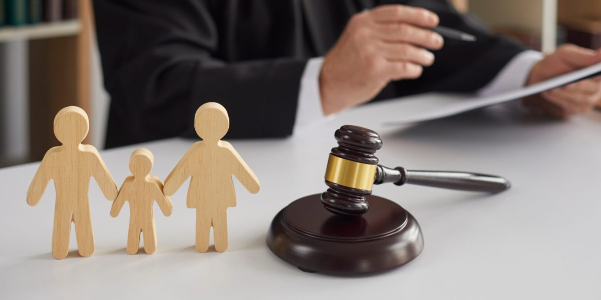 Close,Up,Of,Wooden,Figurines,Of,Family,With,Child,And